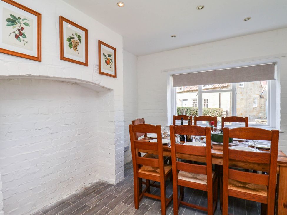 A dining room with a table and chairs at the Farmhouse in Whitby