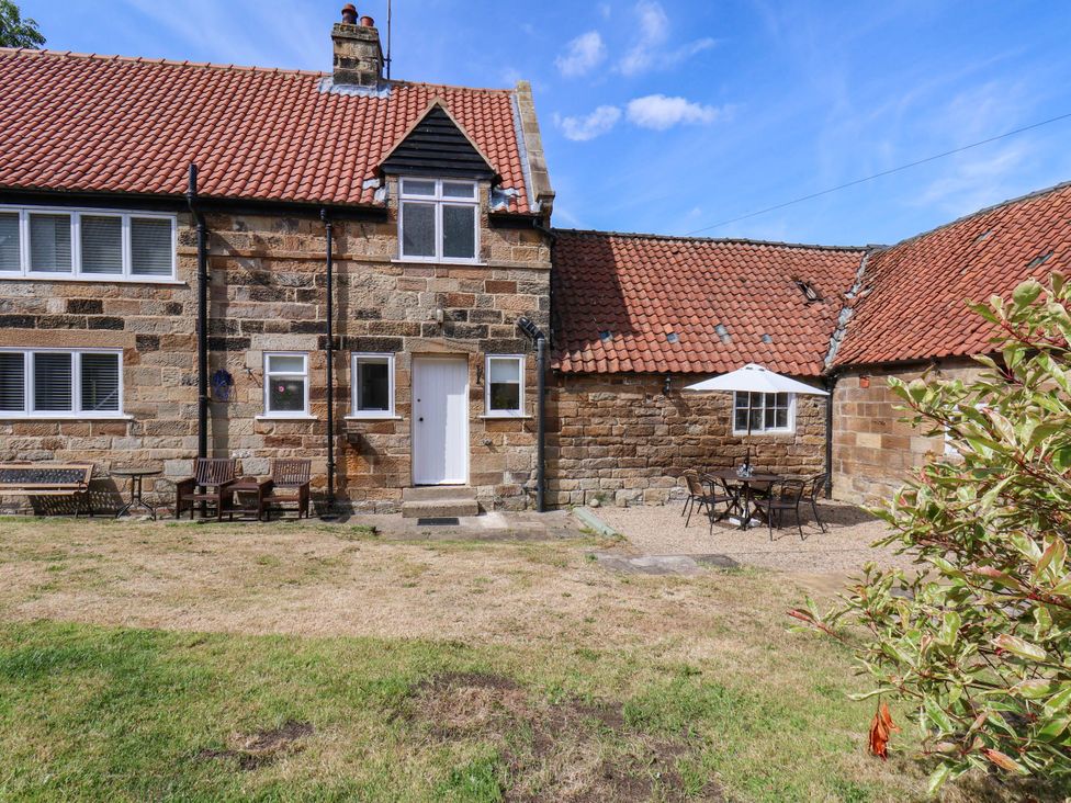 A house with outdoor seating area at Farmhouse in Whitby