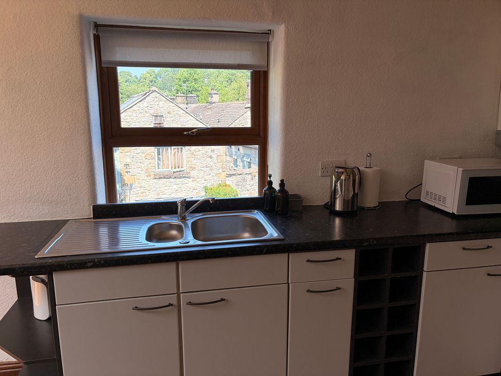 A kitchen with a sink and appliances at The Brew House in Bakewell