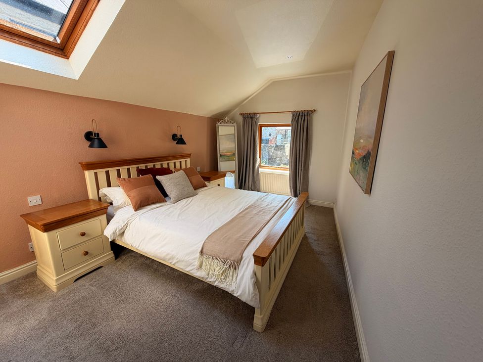 A bedroom with a bed and nightstand at The Brew House in Bakewell