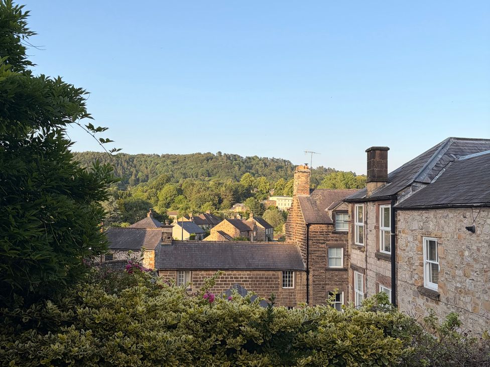 A view of buildings and trees from an outdoor area at The Brew House in Bakewell