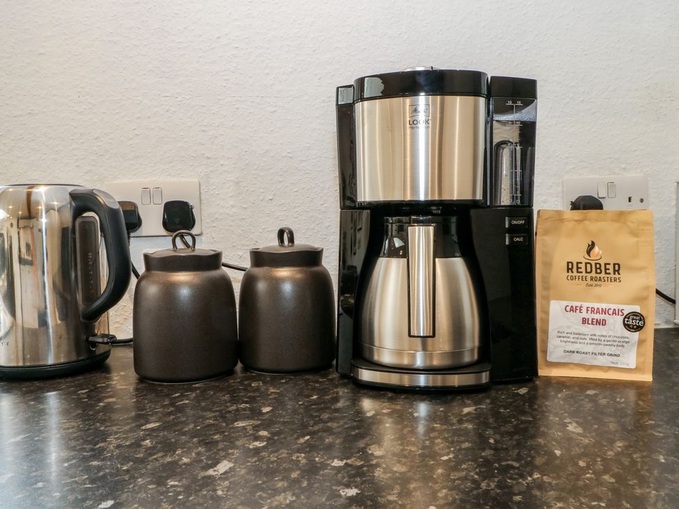 A coffee maker and kettle on a kitchen countertop at The Brew House in Bakewell
