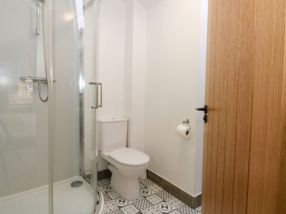 A bathroom with a shower and toilet at The Brew House in Bakewell