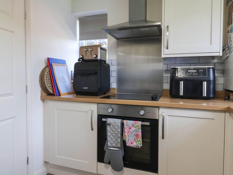 A kitchen with a toaster and air fryer on the countertop at 3 Mill Lane with HT in Grimsby