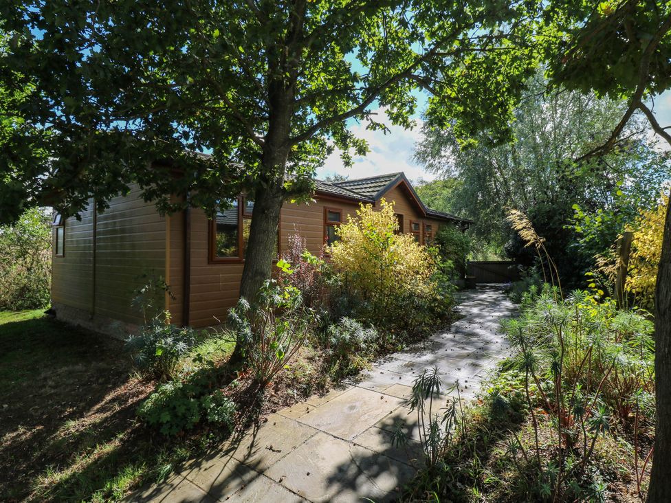 A house with pathway and greenery at Oak Lodge Battisford near Stowmarket