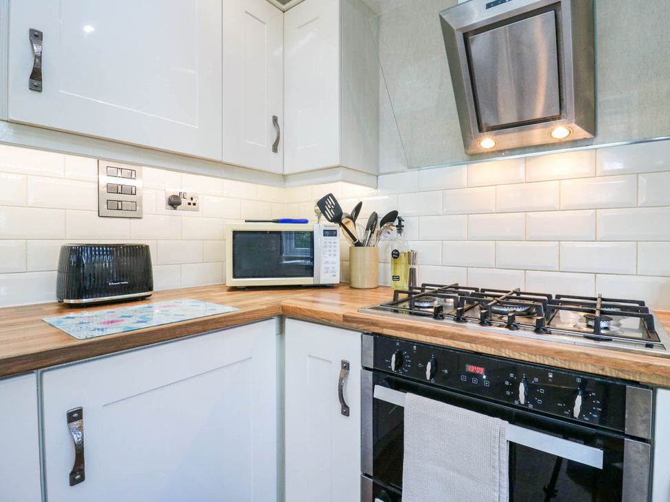 A kitchen with appliances and utensils at Oak Lodge in Battisford near Stowmarket