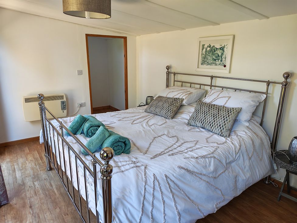 A bedroom with a bed and towels at Hazel Lodge in Constantine