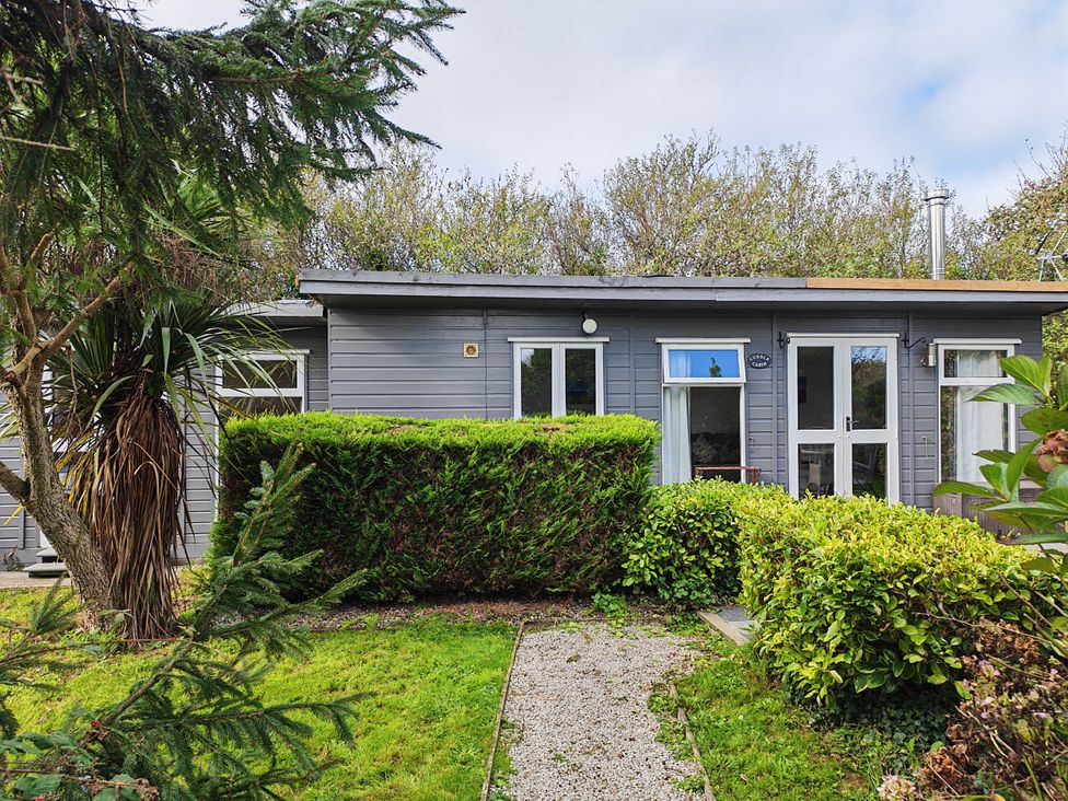 A cabin surrounded by greenery at Hazel Lodge in Constantine