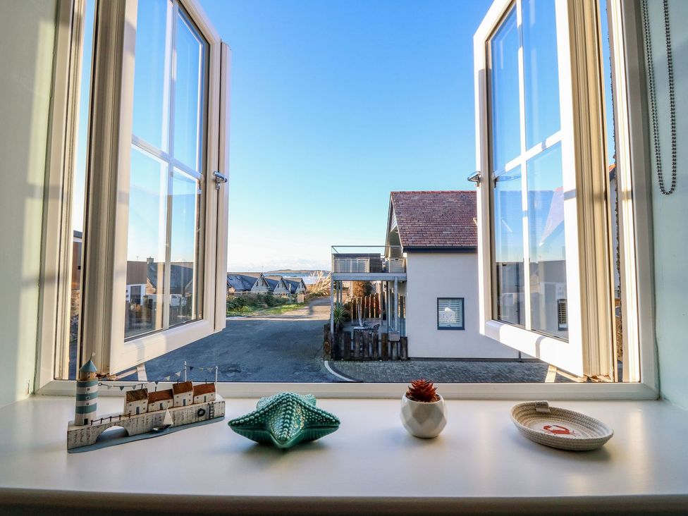 A window view with decorative objects at Bryn Tirion - Rhosneigr