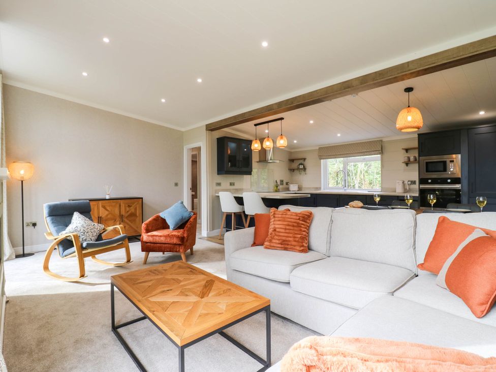 A living room with a sofa and coffee table at Cherry Lodge Battisford near Stowmarket