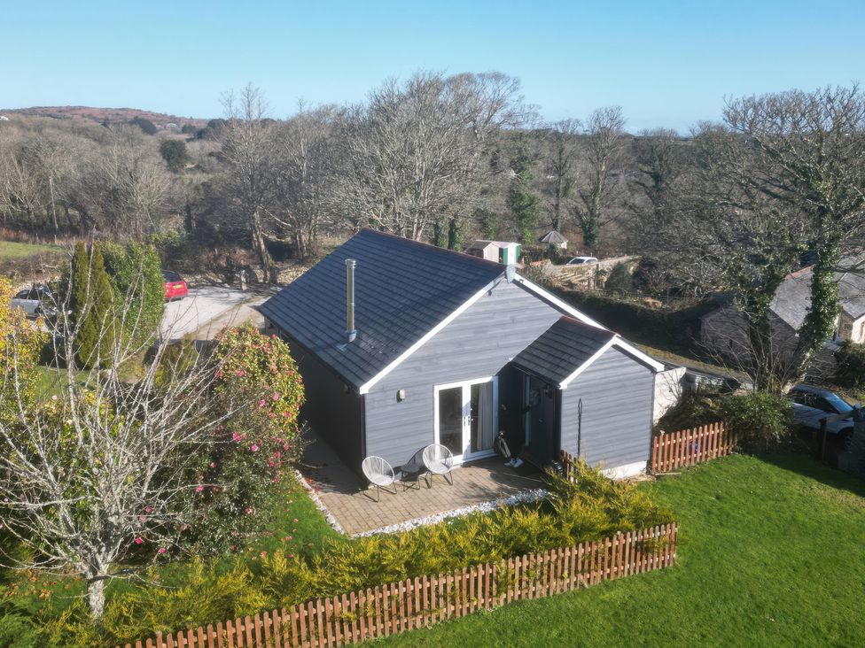 A house with a deck and chairs at Willow Cottage in Constantine
