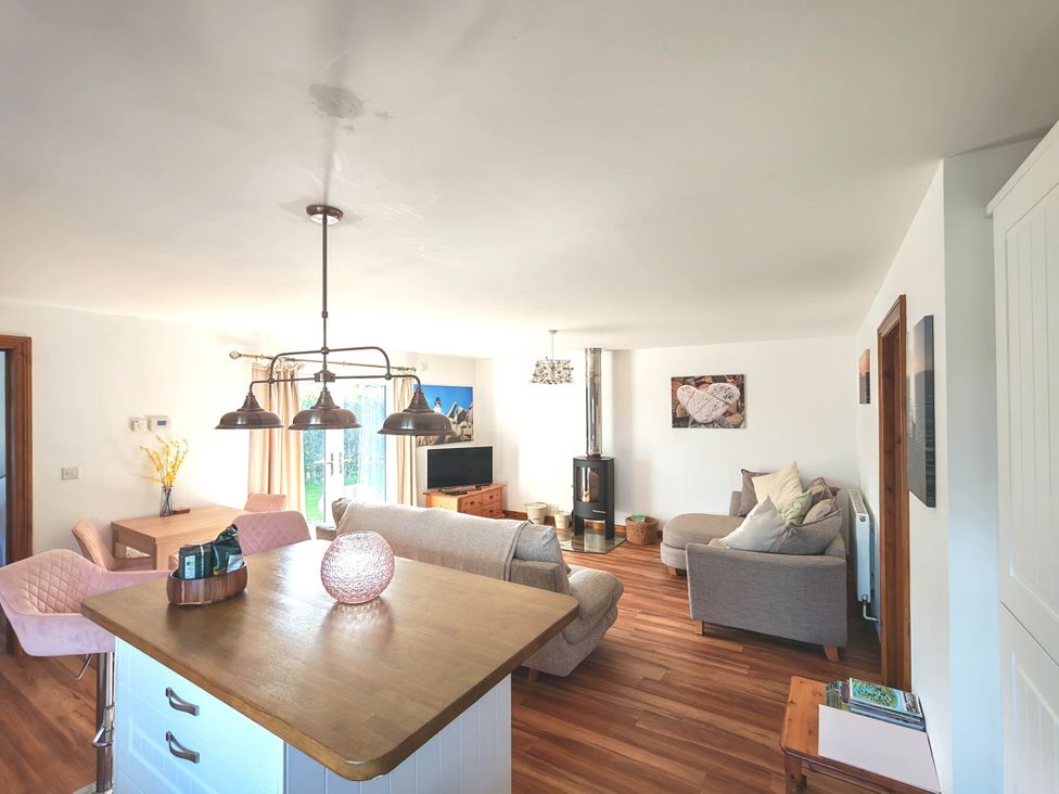 A living room with a sofa and table at Willow Lodge in Constantine