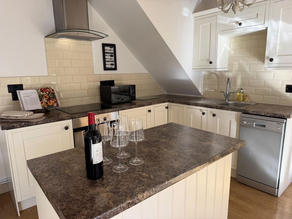A kitchen with appliances and a countertop at Honey Pot Cottage near Harrogate