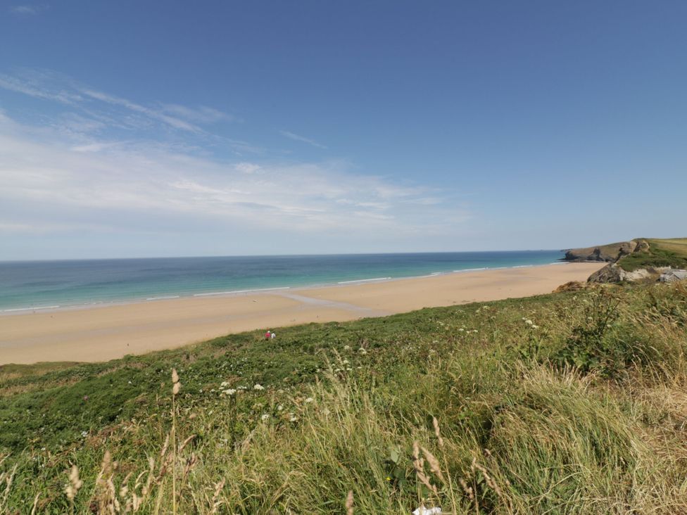 A beach with ocean view and grass in the foreground at 1 Grenville Road, Truro