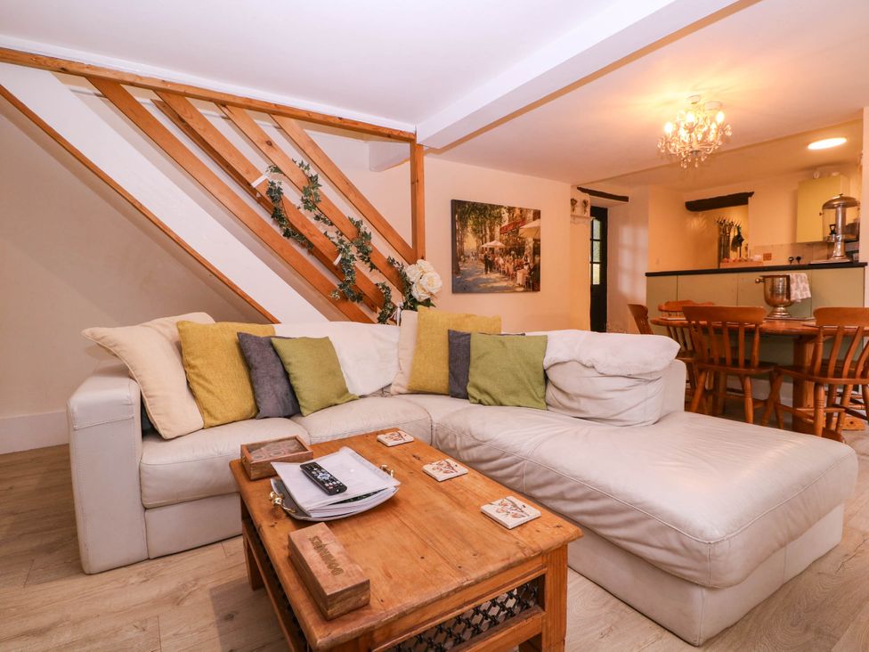 A living room with a sofa and coffee table at The Warm Hearth in Hereford