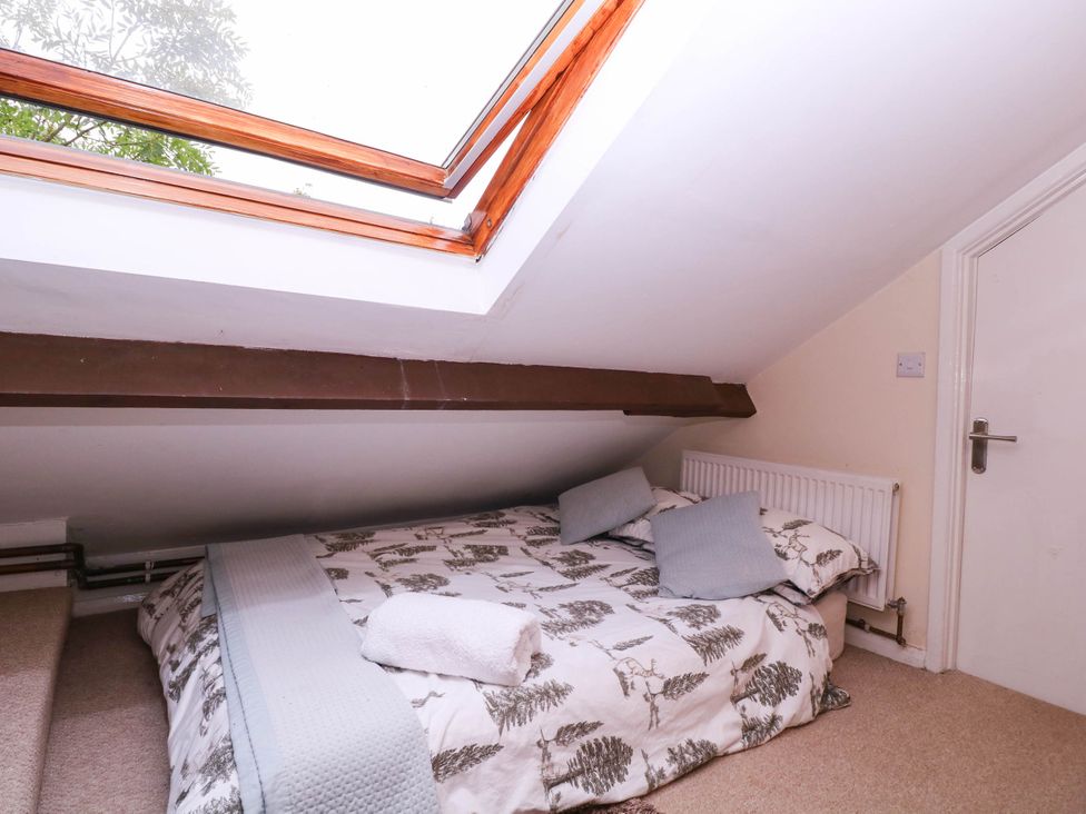 A bedroom with a bed and skylight at The Warm Hearth in Hereford