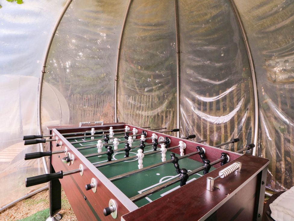 A foosball table in an indoor play area at The Warm Hearth in Hereford