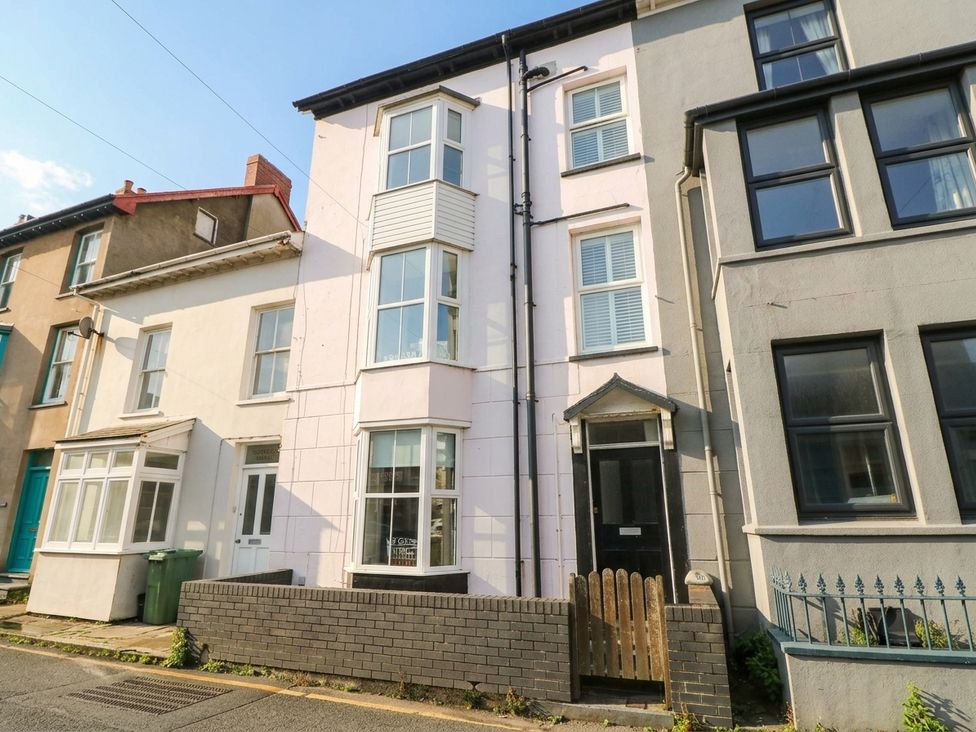 A three-story building with various windows at Y Glyn in Borth