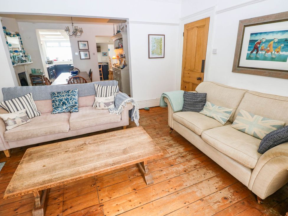 A living room with sofas and a coffee table at Y Glyn in Borth