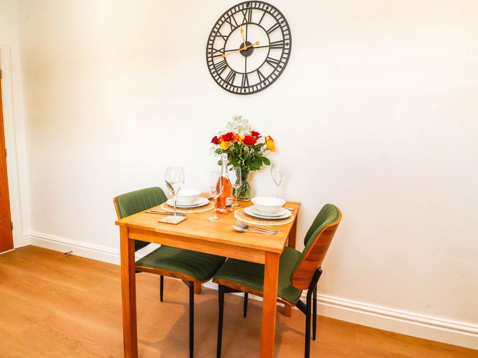 A dining room with a table set for two at The Swallows near Glasson