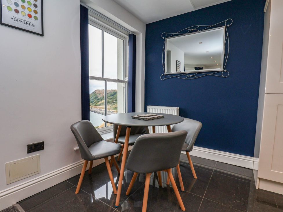 A dining room with a table and chairs at The Gulls Rest 