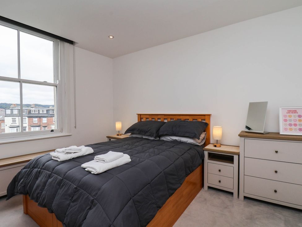 A bedroom with a bed and dresser at The Gulls Rest in 