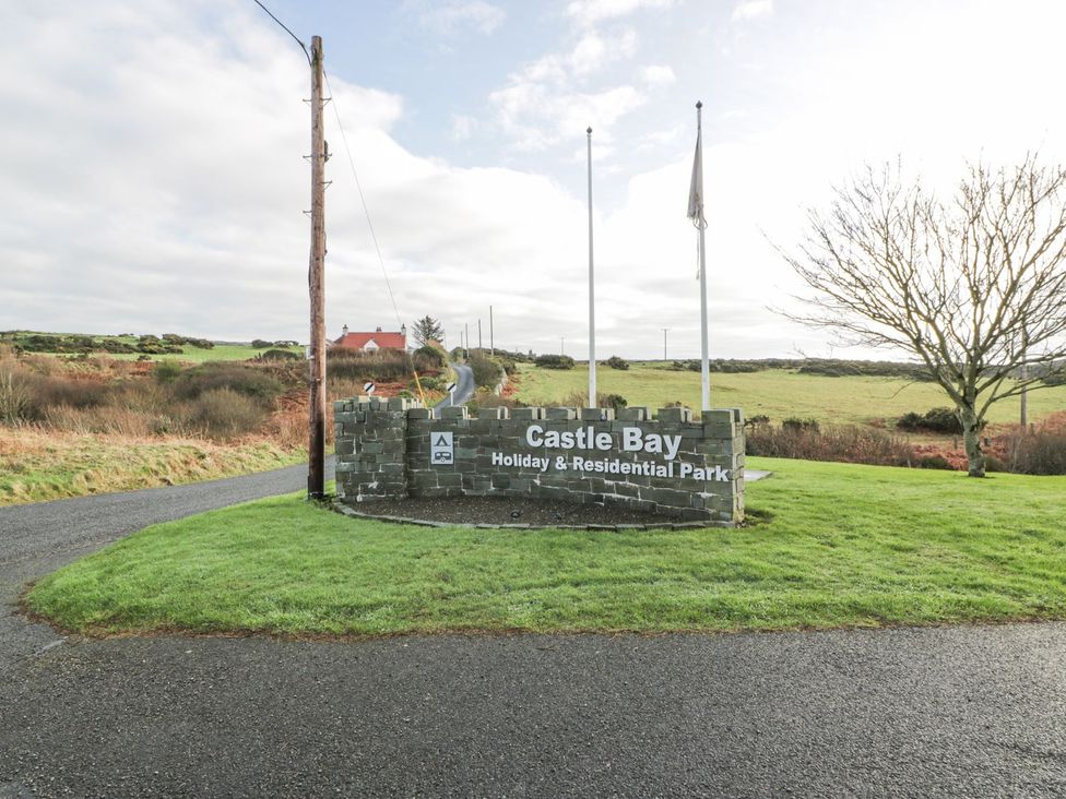 A sign for Castle Bay Holiday & Residential Park at Dunskey Way in Portpatrick
