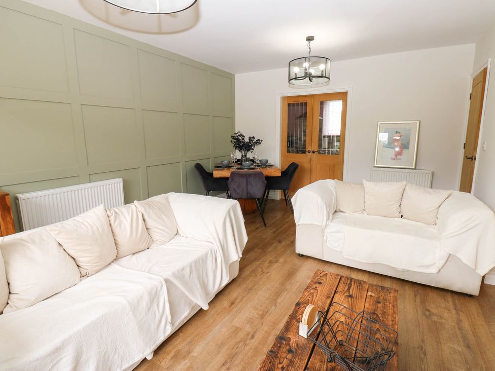 A living room with sofas and a dining table at The Greenway in Darlington