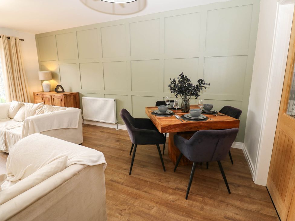 A dining room with a table and chairs at The Greenway in Darlington