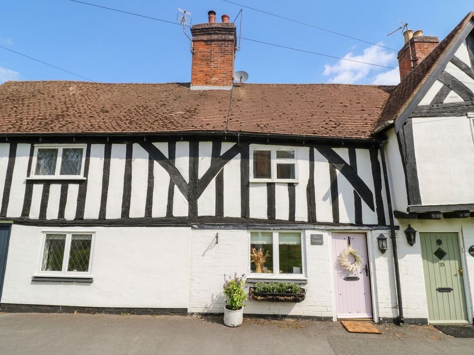 A house exterior with black and white timber framing at Lilac Cottage in Brinklow