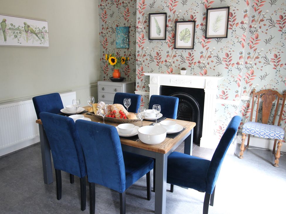 A dining room with a table and chairs at The Hampton in Scarborough