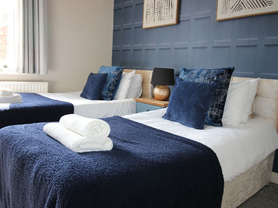 A bedroom with two beds and pillows at The Hampton in Scarborough