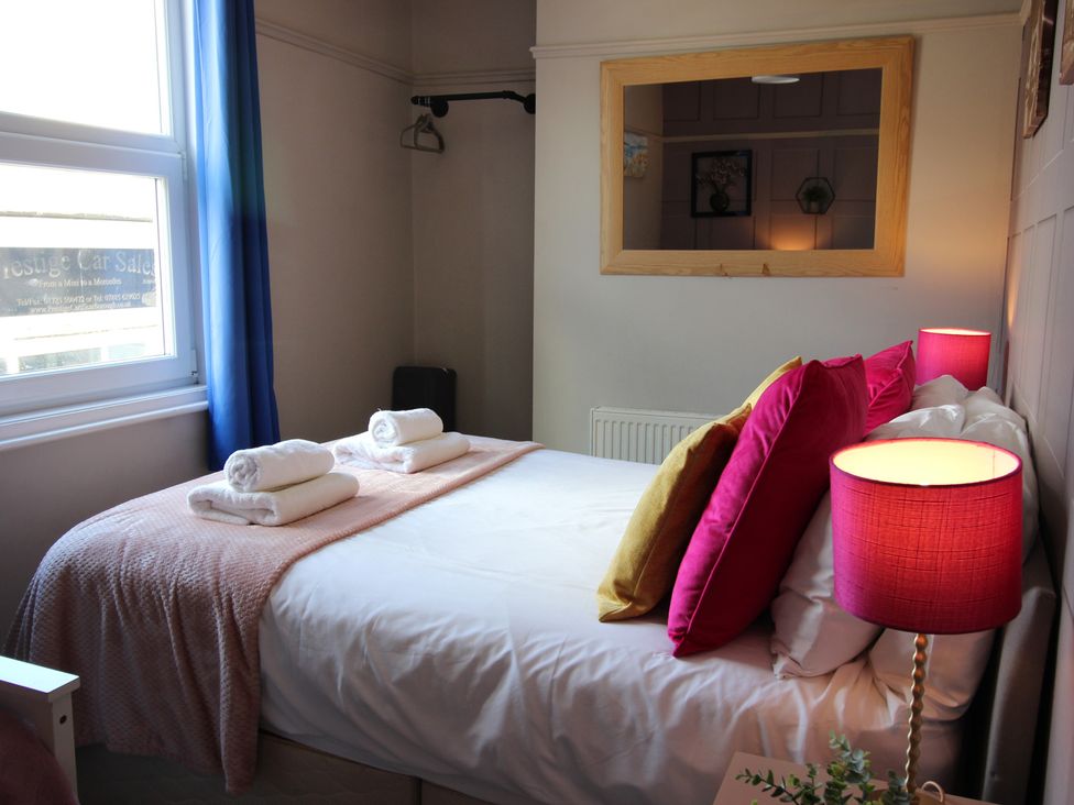 A bedroom with a bed and pillows at The Trafalgar in Scarborough