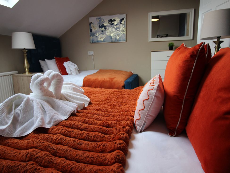 A bedroom with beds and pillows at Brinkburn House in Scarborough