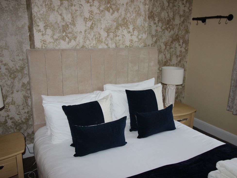 A bedroom with a bed and pillows at Brinkburn House in Scarborough