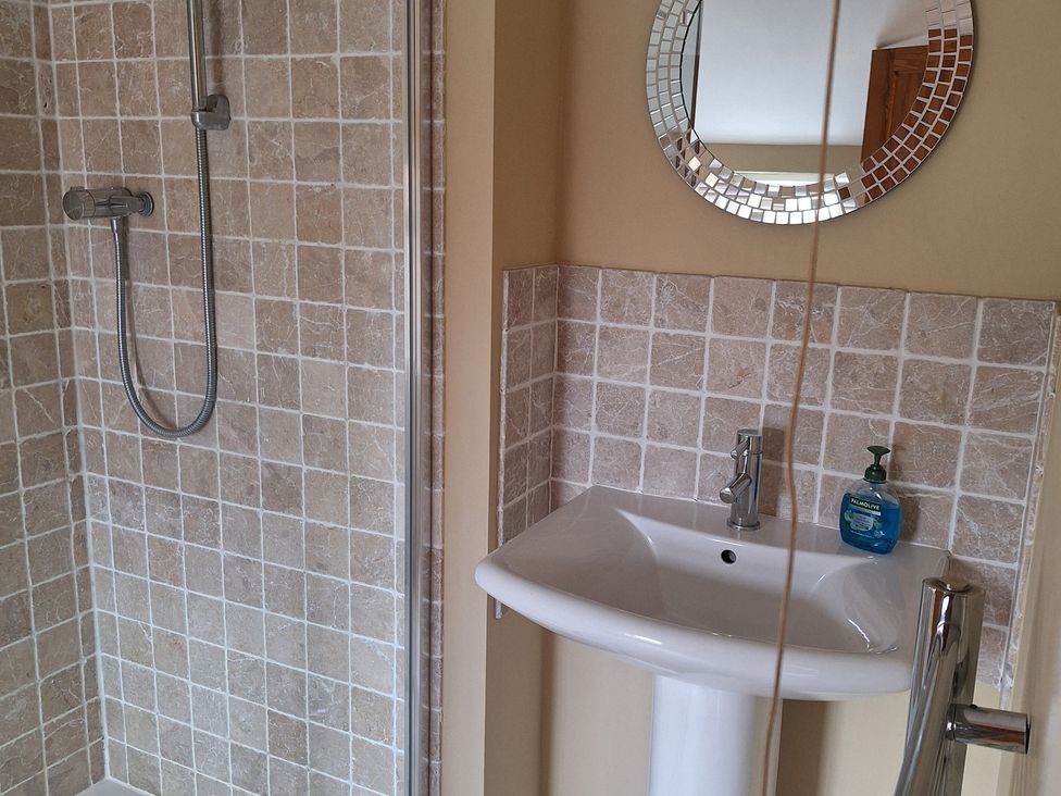 A bathroom with a shower and sink at Fryers Cottage Seamer, North Yorkshire