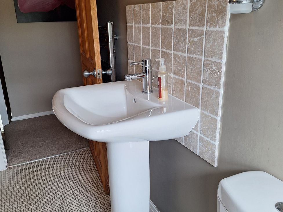 A sink and toilet in a bathroom at Fryers Cottage, Seamer, North Yorkshire