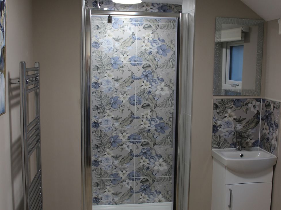 A bathroom with a shower and sink at Blackburn Heights Apartment 1 Bridlington