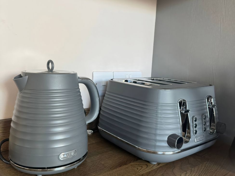A kettle and toaster on a countertop at Blackburn Heights Apartment 3 in Bridlington
