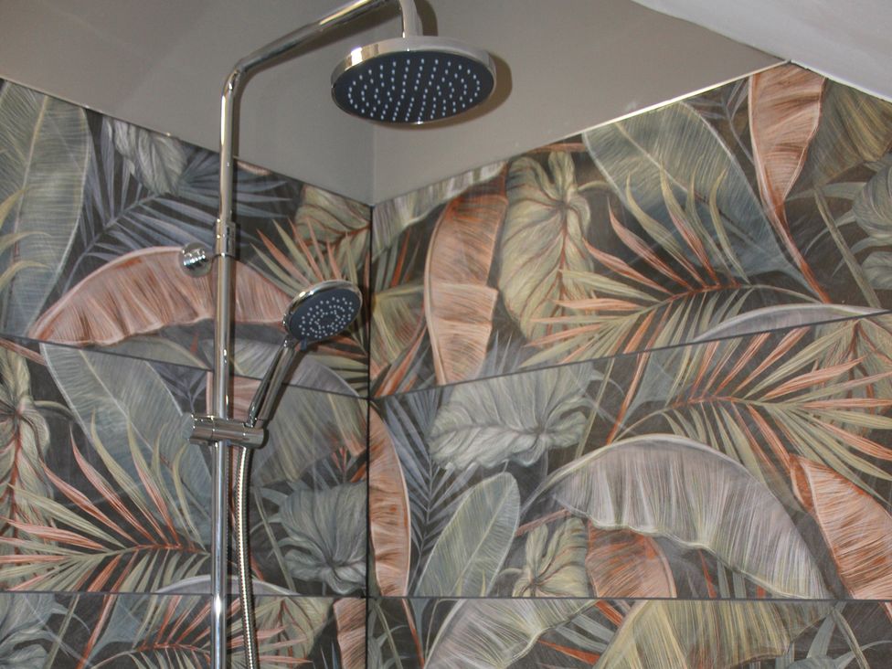 A shower with shower head and hand shower at Blackburn Heights Apartment 3 in Bridlington