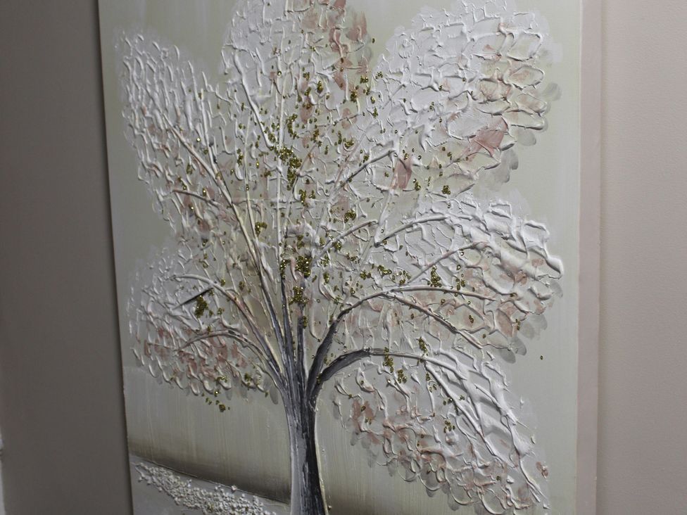 A textured art piece of a tree on canvas at Blackburn Heights Apartment 3 in Bridlington
