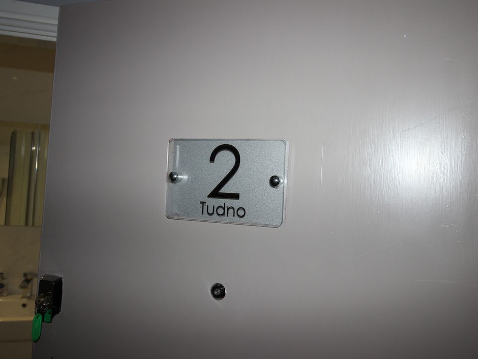 A door with a number sign at Cornerhouse Apartment 2 in Llandudno