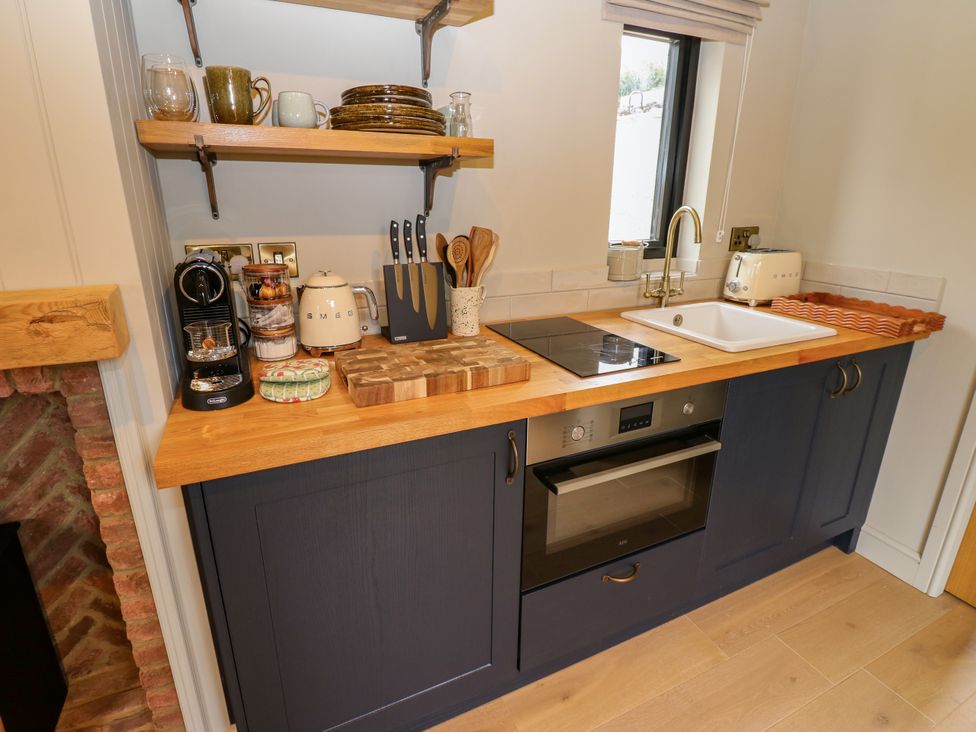 A kitchen with appliances and utensils at 2 West Dunkirk Neuk in Hexham