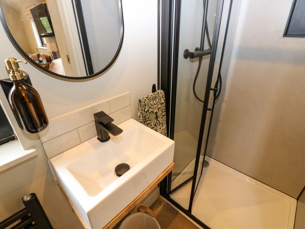 A bathroom with a sink and shower at 2 West Dunkirk Neuk Hexham