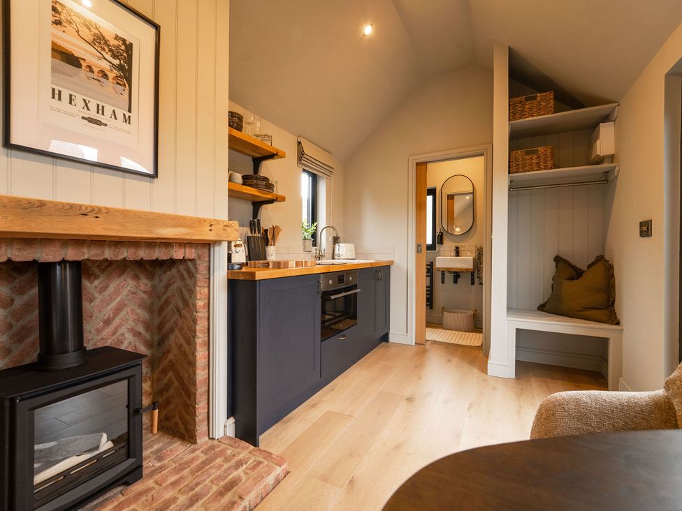 A kitchen with a stove and sink at 2 West Dunkirk Neuk in Humshaugh
