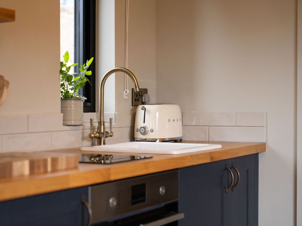 A kitchen with a sink and a toaster at 2 West Dunkirk Neuk in Humshaugh