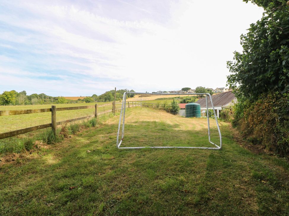 An outdoor area with a goalpost and water tank at Coedllys Uchaf Cottage