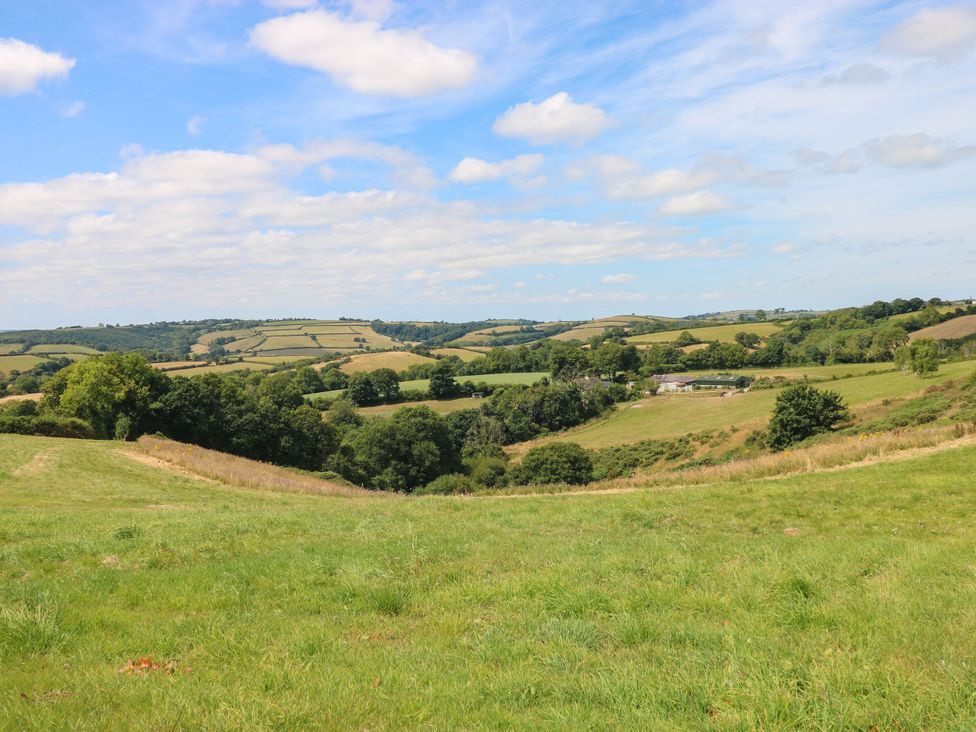 A view of rolling hills and fields at Coedllys Uchaf Cottage 