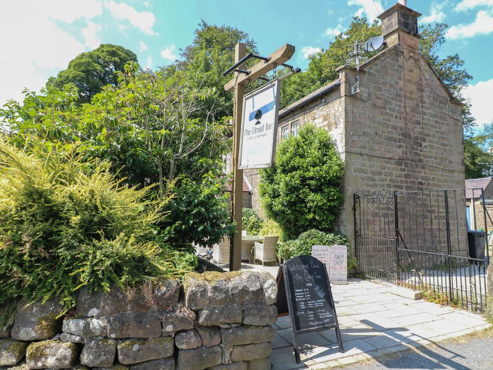A sign and building at The Druid Inn in Derbyshire