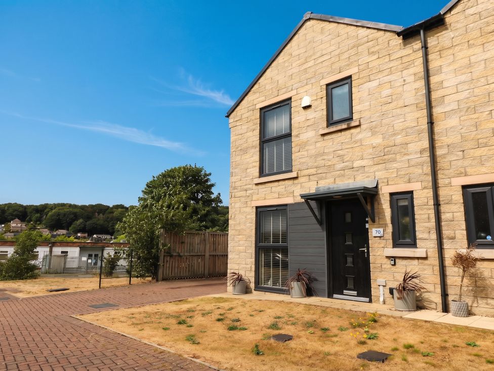 A building exterior with a door and windows at Canal House in Shipley